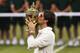 LONDON, ENGLAND - JULY 08: Roger Federer of Switzerland kisses the winner's trophy after winning his Gentlemen's Singles final match against Andy Murray of Great Britain on day thirteen of the Wimbledon Lawn Tennis Championships at the All England Lawn Tennis and Croquet Club on July 8, 2012 in London, England. (Photo by Julian Finney/Getty Images)