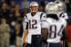 BALTIMORE, MD - SEPTEMBER 23: Tom Brady #12 of the New England Patriots looks towards Deion Branch (R) #84 during warm ups against Baltimore Ravens at M&T Bank Stadium on September 23, 2012 in Baltimore, Maryland. (Photo by Patrick Smith/Getty Images)