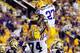 BATON ROUGE, LA - SEPTEMBER 08: Josh Williford #74 and Kenny Hilliard #27 of the LSU Tigers celebrate a touchdown against the Washington Huskies at Tiger Stadium on September 8, 2012 in Baton Rouge, Louisiana. (Photo by Stacy Revere/Getty Images)