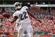 MIAMI GARDENS, FL - SEPTEMBER 16: Reggie Bush #22 of the Miami Dolphins celebrayes a touchdown during a game against the Oakland Raiders at Sun Life Stadium on September 16, 2012 in Miami Gardens, Florida. (Photo by Mike Ehrmann/Getty Images)