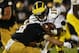 SOUTH BEND, IN - SEPTEMBER 22: Quarterback Denard Robinson #16 of the Michigan Wolverines is tackled by cornerback Bennett Jackson #2 of the Notre Dame Fighting Irish in the third quarter at Notre Dame Stadium on September 22, 2012 in South Bend, Indiana. (Photo by Jonathan Daniel/Getty Images)