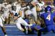 BOISE, ID - SEPTEMBER 20: Taysom Hill #4 of the BYU Cougars is brought down by the Boise State Broncos at Bronco Stadium on September 20, 2012 in Boise, Idaho. (Photo by Otto Kitsinger III/Getty Images)