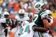 MIAMI GARDENS, FL - SEPTEMBER 23: Cornerback Sean Smith #24 of the Miami Dolphins tackles Tight end Konrad Reuland #87 of the New York Jets at Sun Life Stadium on September 23, 2012 in Miami Gardens, Florida. (Photo by Marc Serota/Getty Images)