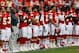 KANSAS CITY, MO - AUGUST 24: Head coach Romeo Crennel of the Kansas City Chiefs stands with players during the National Anthem prior to the NFL preseason game against the Seattle Seahawks at Arrowhead Stadium on August 24, 2012 in Kansas City, Missouri. (Photo by Jamie Squire/Getty Images)