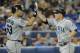 TORONTO, CANADA - SEPTEMBER 11: Kyle Seager #15 (R) of the Seattle Mariners celebrates his home run with teammate Jesus Montero #63 during MLB game action against the Toronto Blue Jays September 11, 2012 at Rogers Centre in Toronto, Ontario, Canada. (Photo by Brad White/Getty Images)