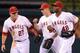 ANAHEIM, CA - SEPTEMBER 21: Torii Hunter #48, Peter Bourjos #25 and Mike Trout #27 of the Los Angeles Angels celebrate a 6-2 win over the Chicago White Sox at Angel Stadium of Anaheim on September 21, 2012 in Anaheim, California. (Photo by Harry How/Getty Images)