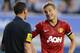 LIVERPOOL, ENGLAND - AUGUST 20: Referee Andre Marriner and Nemanja Vidic of Manchester United have words during the Barclays Premier League match between Everton and Manchester United at Goodison Park on August 20, 2012 in Liverpool, England. (Photo by Michael Regan/Getty Images)