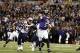 September 23, 2012; Baltimore, MD, USA; Baltimore Ravens quarterback Joe Flacco (5) throws a touchdown pass during the game against the New England Patriots at M&T Bank Stadium. Mandatory Credit: Mitch Stringer-US PRESSWIRE