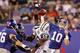 EAST RUTHERFORD, NJ - AUGUST 29: Eli Manning #10 of the New York Giants throws a first half pass under pressure from Bryan Thomas #58 of the New York Jets during their pre season game on August 29, 2011 at MetLife Stadium in East Rutherford, New Jersey. (Photo by Jim McIsaac/Getty Images)