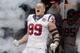 HOUSTON,TX - SEPTEMBER 09: J.J. Watt #99 of the Houston Texans is introduced to the crowd before playing the Miami Dolphins at Reliant Stadium on September 9, 2012 in Houston, Texas. (Photo by Bob Levey/Getty Images)