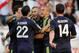 MADRID, SPAIN - SEPTEMBER 24: Karim Benzema (C) of Real Madrid celebrates with Xabi Alonso, Angel Di Maria and Pepe after scoring Real's opening goal during the La Liga match between Rayo Vallecano de Madrid and Real Madrid CF at Estadio Teresa Rivero on September 24, 2012 in Madrid, Spain. (Photo by Denis Doyle/Getty Images)