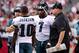 Sept. 23, 2012; Glendale, AZ, USA; Philadelphia Eagles head coach Andy Reid talks with quarterback Michael Vick (7) and wide receiver DeSean Jackson (10) on the field during the game against the Arizona Cardinals in the first half at University of Phoenix Stadium. The Cardinals defeated the Eagles 27 - 6. Mandatory Credit: Jennifer Stewart-US PRESSWIRE