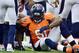 September 23 2012; Denver, CO, USA; Denver Broncos middle linebacker Joe Mays (51) is helped up after an injury during the third quarter of the game against the Houston Texans at Sports Authority Field. The Texans defeated the Broncos 31-25. Mandatory Credit: Ron Chenoy-US PRESSWIRE