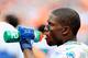 MIAMI GARDENS, FL - SEPTEMBER 16: Running back Reggie Bush #22 of the Miami Dolphins looks on from the sideline during the game against the Oakland Raiders at Sun Life Stadium on September 16, 2012 in Miami Gardens, Florida. (Photo by Chris Trotman/Getty Images)