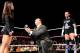 Paul Heyman proposes to AJ as CM Punk looks on. (Courtesy of WWE.com)