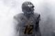 MORGANTOWN, WV - SEPTEMBER 22: Geno Smith #12 of the West Virginia Mountaineers leads the team onto the field before the game against the Maryland Terrapins on September 22, 2012 at Mountaineer Field in Morgantown, West Virginia. (Photo by Justin K. Aller/Getty Images)