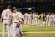 ARLINGTON, TX - SEPTEMBER 25:Josh Reddick #16 of the Oakland Athletics walks to the dugout as manager Bob Melvin #6 congratulates the team for the win against the Texas Rangers at Rangers Ballpark in Arlington on September 25, 2012 in Arlington, Texas. (Photo by Rick Yeatts/Getty Images)