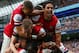 MANCHESTER, ENGLAND - SEPTEMBER 23: Laurent Koscielny of Arsenal is mobbed by his team mates after scoring their first goal during the Barclays Premier League match between Manchester City and Arsenal at Etihad Stadium on September 23, 2012 in Manchester, England. (Photo by Alex Livesey/Getty Images)