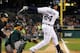 DETROIT, MI - SEPTEMBER 18: Miguel Cabrera #24 of the Detroit Tigers hits a fifth inning double in front of George Kottaras #14 of the Oakland Athletics at Comerica Park on September 18, 2012 in Detroit, Michigan. Detroit won the game 12-2. (Photo by Gregory Shamus/Getty Images)