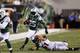 CINCINNATI, OH - AUGUST 10: Joe McKnight #25 of the New York Jets tries to break a tackle by Dan Skuta #51 of the Cincinnati Bengals during a preseason NFL game at Paul Brown Stadium on August 10, 2012 in Cincinnati, Ohio. (Photo by Joe Robbins/Getty Images)