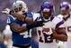 INDIANAPOLIS, IN - SEPTEMBER 16: Percy Harvin #12 of the Minnesota Vikings runs with the ball while defended by Antoine Bethea #41 of the Indianapolis Colts during the NFL game at Lucas Oil Stadium on September 16, 2012 in Indianapolis, Indiana. (Photo by Andy Lyons/Getty Images)