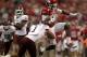 ARLINGTON, TX - OCTOBER 01: Cobi Hamilton #11 of the Arkansas Razorbacks runs the ball against Trent Hunter #1 of the Texas A&M Aggies at Cowboys Stadium on October 1, 2011 in Arlington, Texas. (Photo by Ronald Martinez/Getty Images)