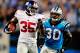 CHARLOTTE, NC - SEPTEMBER 20: Andre Brown #35 of the New York Giants breaks away from Charles Godfrey #30 of the Carolina Panthers for a long gain during play at Bank of America Stadium on September 20, 2012 in Charlotte, North Carolina. (Photo by Grant Halverson/Getty Images)