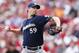 CINCINNATI, OH - SEPTEMBER 27: John Axford #59 of the Milwaukee Brewers pitches against the Cincinnati Reds during the game at Great American Ball Park on September 27, 2012 in Cincinnati, Ohio. The Reds won 2-1. (Photo by Joe Robbins/Getty Images)