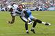 NASHVILLE, TN - SEPTEMBER 18: Kenny Britt #18 of the Tennessee Titan is tackled in the end zone after catching a pass for a touchdown during a game against the Baltimore Ravens at the LP Field on September 18, 2011 in Nashville, Tennessee. The Titans defeated the Ravens 26 to 13. (Photo by Wesley Hitt/Getty Images)