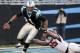 CHARLOTTE, NC - DECEMBER 11: Quarterback Cam Newton #1 of the Carolina Panthers tries to break away from Dan Connor #55 of the Atlanta Falcons at Bank of America Stadium on December 11, 2011 in Charlotte, North Carolina. (Photo by Jared C. Tilton/Getty Images)