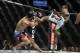 May 15, 2012; Fairfax, VA, USA; Yves Jabouin (right) leans into a kick toward a falling Jeff Hougland (left) during the Korean zombie vs Poirier event at Patriot Center. Mandatory Credit: Rafael Suanes-US PRESSWIRE