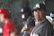JUPITER, FL - MARCH 18: Manager Ozzie Guillen #13 of the Miami Marlins takes shelter from the rain during a game against the St. Louis Cardinals at Roger Dean Stadium on March 18, 2012 in Jupiter, Florida. (Photo by Sarah Glenn/Getty Images)