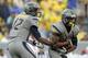 MORGANTOWN, WV - SEPTEMBER 22: Geno Smith #12 of the West Virginia Mountaineers hands the ball off to Tavon Austin #1 against the Maryland Terrapins during the game on September 22, 2012 at Mountaineer Field in Morgantown, West Virginia. WVU defeated Maryland 31-21. (Photo by Justin K. Aller/Getty Images)