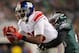 PHILADELPHIA - NOVEMBER 21: Hakeem Nicks #88 of the New York Giants tries to break the tackle of Dimitri Patterson #23 of the Philadelphia Eagles at Lincoln Financial Field on November 21, 2010 in Philadelphia, Pennsylvania. (Photo by Nick Laham/Getty Images)