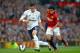 MANCHESTER, ENGLAND - SEPTEMBER 29: Gareth Bale of Tottenham Hotspur is closed down by Rafael Da Silva of Manchester United during the Barclays Premier League match between Manchester United and Tottenham Hotspur at Old Trafford on September 29, 2012 in Manchester, England. (Photo by Shaun Botterill/Getty Images)