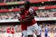 LONDON, ENGLAND - SEPTEMBER 29: Arsenal's Gervinho celebrates scoring their first goal of the match with teammate Alex Oxlade-Chamberlain during the Barclays Premier League match between Arsenal and Chelsea at Emirates Stadium on September 29, 2012 in London, England. (Photo by Richard Heathcote/Getty Images)