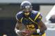MORGANTOWN, WV - SEPTEMBER 29: Geno Smith #12 of the West Virginia Mountaineers runs the ball against the Baylor Bears during the game on September 29, 2012 at Mountaineer Field in Morgantown, West Virginia. (Photo by Justin K. Aller/Getty Images)