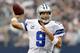 ARLINGTON, TX - SEPTEMBER 23: Tony Romo #9 of the Dallas Cowboys looks for an open receiver against the Tampa Bay Buccaneers at Cowboys Stadium on September 23, 2012 in Arlington, Texas. (Photo by Tom Pennington/Getty Images)