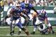 Sept 9, 2012; East Rutherford, NJ, USA; Buffalo Bills running back Fred Jackson (22) breaks a tackle by New York Jets linebacker Bart Scott (57) during the first half at MetLife Stadium. Mandatory Credit: Ed Mulholland-US PRESSWIRE