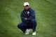 MEDINAH, IL - SEPTEMBER 30: Tiger Woods of the USA watches from the first fairway during the Singles Matches for The 39th Ryder Cup at Medinah Country Club on September 30, 2012 in Medinah, Illinois. (Photo by Andrew Redington/Getty Images)