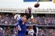 Sept. 30, 2012; Orchard Park, NY, USA; Buffalo Bills tight end Scott Chandler (84) jumps to catch a ball while being defended by New England Patriots free safety Patrick Chung (25) during the first half at Ralph Wilson Stadium. Mandatory Credit: Timothy T. Ludwig-US PRESSWIRE
