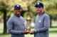 Tiger Woods and Davis Love III holding the Ryder Cup