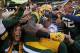 GREEN BAY, WI - SEPTEMBER 30: James Jones #89 of the Green Bay Packers leaps into the stands after catching a touchdown pass against the New Orleans Saints at Lambeau Field on September 30, 2012 in Green Bay, Wisconsin. (Photo by Jonathan Daniel/Getty Images)