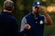 MEDINAH, IL - SEPTEMBER 29: USA team captain Davis Love III (L) greets Tiger Woods on the 18th green during day two of the Afternoon Four-Ball Matches for The 39th Ryder Cup at Medinah Country Club on September 29, 2012 in Medinah, Illinois. (Photo by Jamie Squire/Getty Images)
