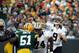 Sept. 30, 2012; Green Bay, WI, USA; New Orleans quarterback Drew Brees (9) throws a pass over Green Bay Packers defenders at Lambeau Field. The Green Bay Packers defeated the New Orleans Saints 28-27. Mandatory Credit: Mary Langenfeld-US PRESSWIRE