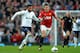 MANCHESTER, ENGLAND - SEPTEMBER 29: Sandro of Tottenham Hotspur and Michael Carrick of Manchester United battle for the ball during the Barclays Premier League match between Manchester United and Tottenham Hotspur at Old Trafford on September 29, 2012 in Manchester, England. (Photo by Shaun Botterill/Getty Images)