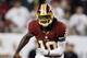 Sept. 30, 2012; Tampa FL, USA; Washington Redskins quarterback Robert Griffin III (10) scrambles for a first down against the Tampa Bay Buccaneers late in the fourth quarter at Raymond James Stadium. Washington defeated Tampa Bay 24-22. Mandatory Credit: Matt Stamey-US PRESSWIRE