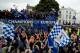 LONDON, ENGLAND - MAY 20: Chelsea supporters celebrate as they leave Stamford Bridge on an open top bus during the Chelsea victory parade following their UEFA Champions League and FA Cup victories on May 20, 2012 in London, England. (Photo by Alan Crowhurst/Getty Images)