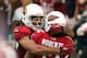 GLENDALE, AZ - SEPTEMBER 30: Wide receiver Larry Fitzgerald #11 of the Arizona Cardinals celebrates with wide receiver Andre Roberts #12 after Roberts scored a 46 yard touchdown reception against the Miami Dolphins during the fourth quarter of the NFL game at the University of Phoenix Stadium on September 30, 2012 in Glendale, Arizona. The Carindals defeated the Dolphins 24-21 in overtime. (Photo by Christian Petersen/Getty Images)