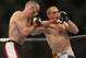 September 22, 2012; Toronto, ON, CANADA; UFC fighter T.J. Grant punches UFC fighter Evan Dunham (right) in the lightweight bout during UFC 152 at the Air Canada Centre. Mandatory Credit: Tom Szczerbowski-US PRESSWIRE